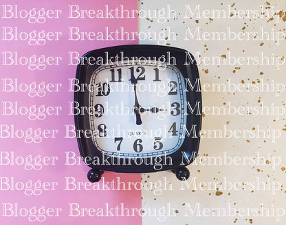 A clock on a pink background, perfect for Blogger Breakthrough Summit&