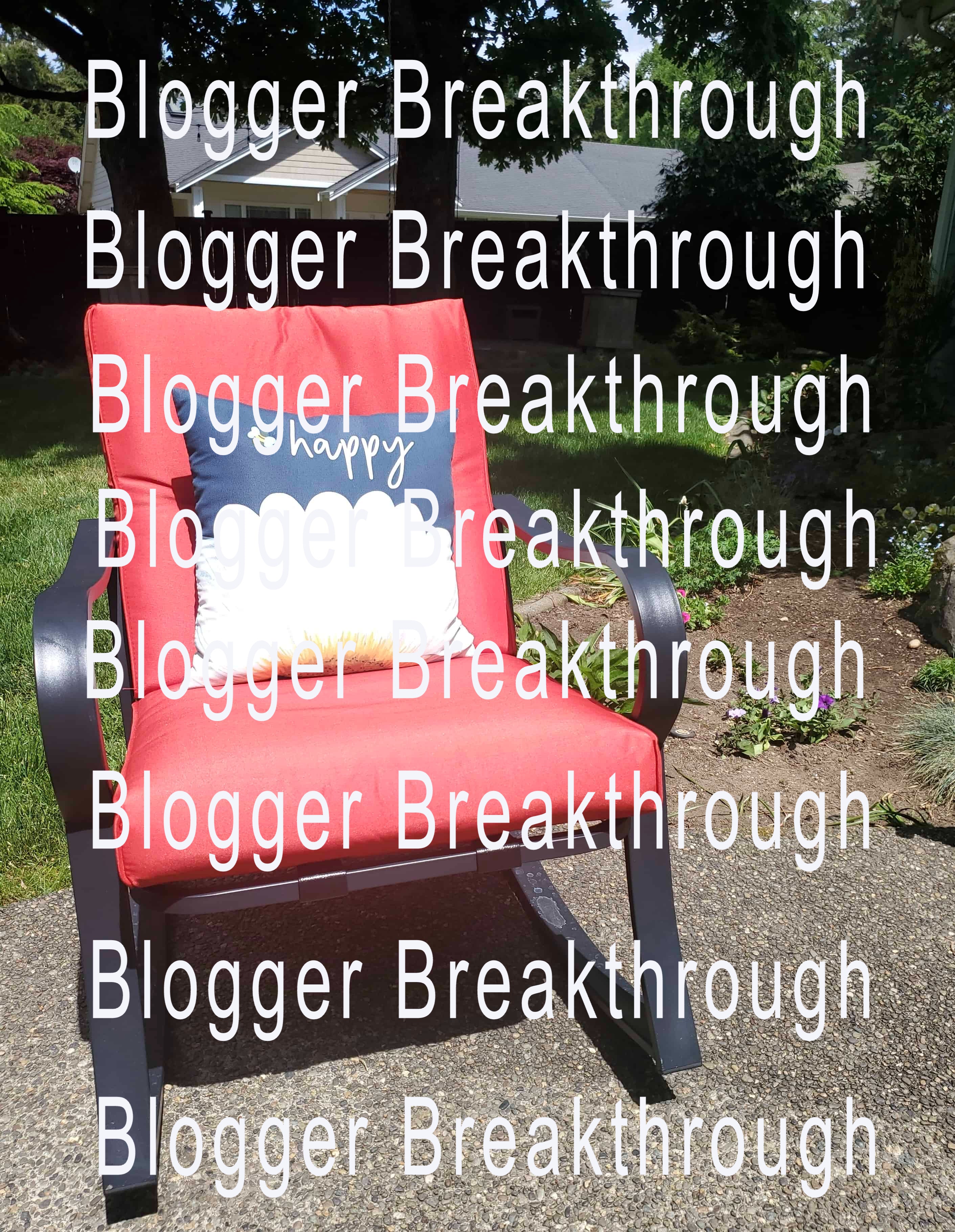 A red armchair outdoors with the repeated phrase &quot;blog stand out&quot; overlaid as a watermark from the Blogger Breakthrough Summit&